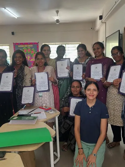 A group of proud teachers holding their certificates after completing a 'Math From Scratch' training session. This moment represents the successful culmination of our collaborative work, equipping educators with new tools and confidence.