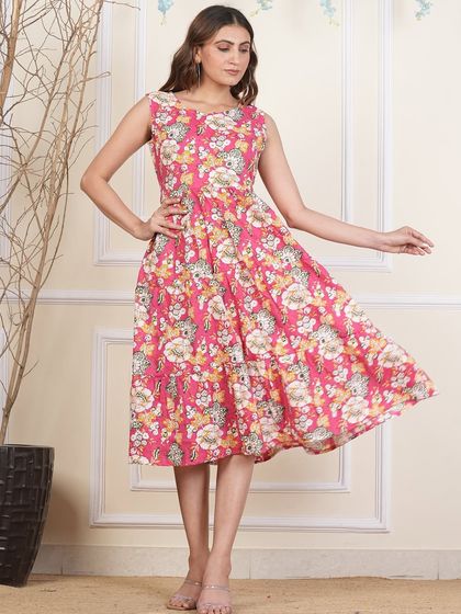 A different pink floral print on my popular tiered dress design. The handmade nature of block prints means each dress has a unique character.