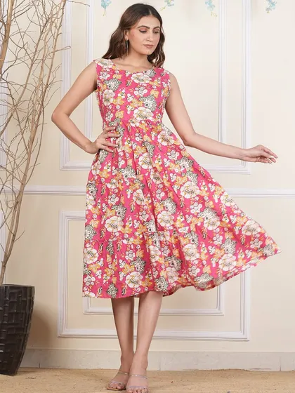 A different pink floral print on my popular tiered dress design. The handmade nature of block prints means each dress has a unique character.