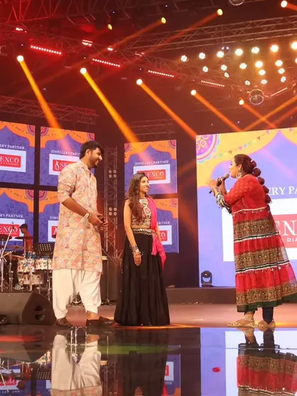 Interacting with guests on stage during Day 6, ensuring everyone feels welcome.