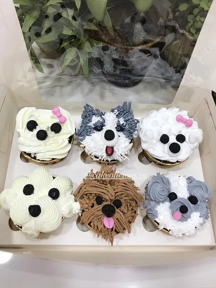 How cute are these puppy-faced cupcakes? I had so much fun piping the different fur textures and expressions for a dog lover's birthday. I can create custom designs like these to match any theme or passion.
