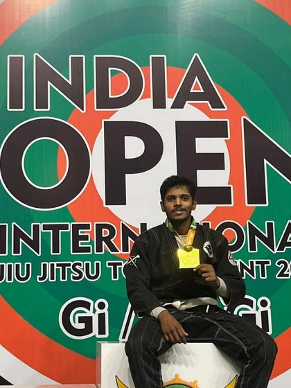 On the podium after winning the Gold medal in the -76kg Gi division at the India Open International Jiu-Jitsu Tournament 2024. A proud moment in front of the official event banner.