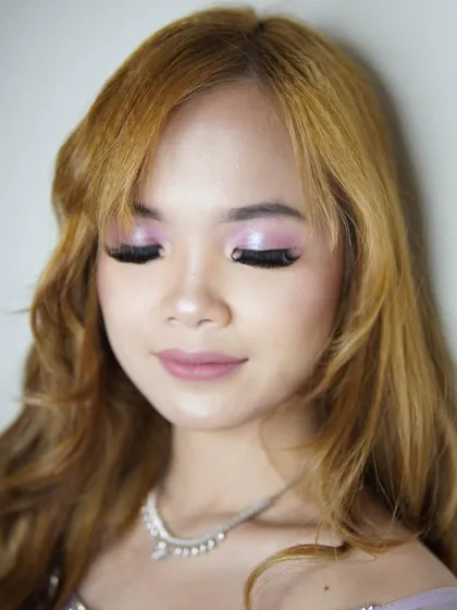 Another angle of the purple spotlight eye, showing the seamless blend and the glossy finish on the skin. This kind of makeup is perfect for beauty editorials where the focus is entirely on the makeup itself.