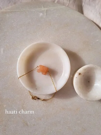 Another view of the 'haati' peach moonstone elephant bracelet. This piece is designed to help with new beginnings and soothe emotional instability.