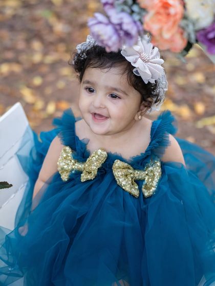 A close-up of the birthday girl's happy smile during her outdoor shoot. The natural light makes her sparkle.