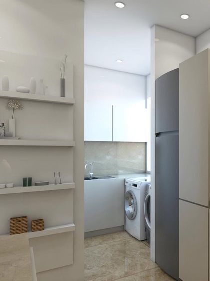 A look at a compact kitchen design where we incorporated all the essentials, including a bottle pullout unit and a grain trolley. We utilized the attached balcony as a wet area to make the kitchen feel larger and more efficient.