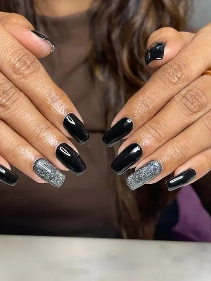 The full two-hand view of the black and silver glitter set. The contrast is dramatic and perfect for a night out.