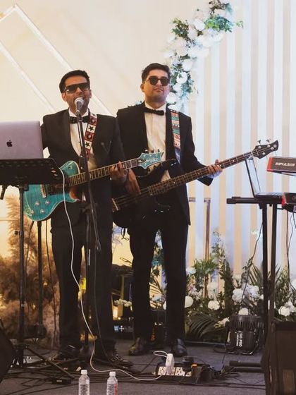 A vintage-toned shot of the band performing at a wedding. We bring a touch of class to every celebration.