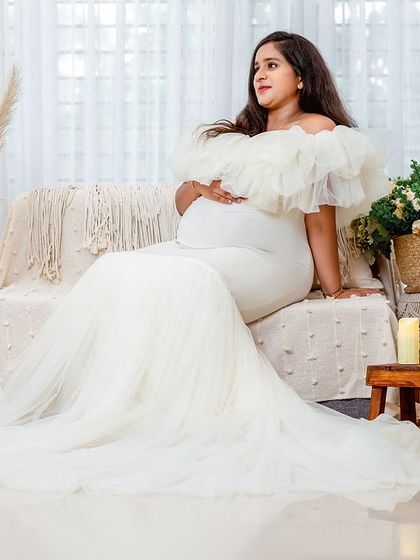 A duplicate of 78, this image captures the full beauty of the white gown and the thoughtfully curated bohemian studio set.