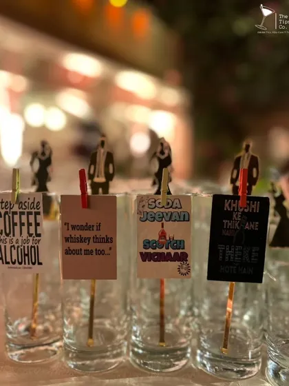We love adding a bit of fun to our presentation. These glasses are adorned with quirky, custom-made tags and stirrers, adding personality to every drink served.