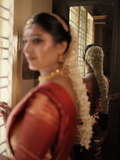 A glimpse of the traditional South Indian bridal hairstyle. The long braid adorned with fresh jasmine flowers is a classic element that I love incorporating into my bridal looks.