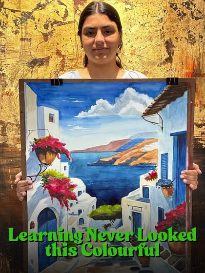 Learning never looked this colorful. This student is showcasing her vibrant painting of a coastal town, a testament to her hard work and newfound skills.