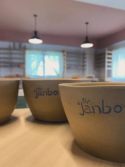 A few of our studio-branded bowls, waiting for their turn in the kiln. Seeing our name on these pieces always feels special.