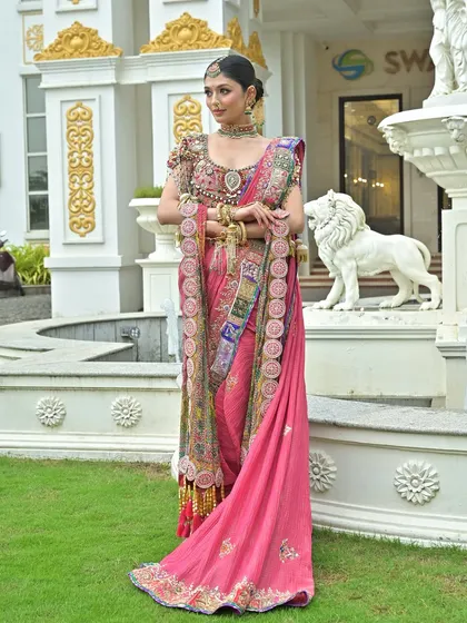 A confident pose from a bride in a modern pink Nauvari, showing how tradition can be stylish and contemporary.
