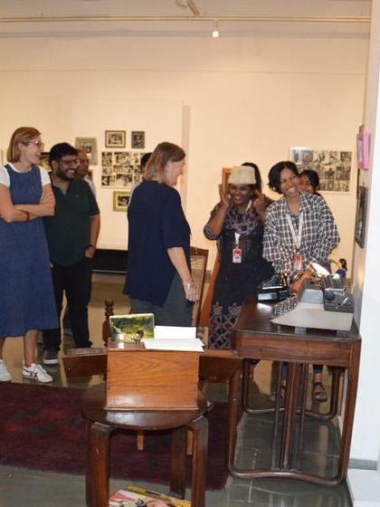 The MAP team gathered around the recreated living room set.