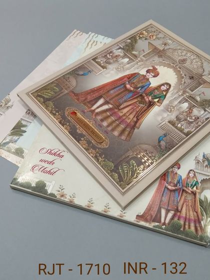 This invitation features a classic portrait of a royal couple, framed with elegant borders. The design is timeless and printed on high-quality paper for a premium feel.