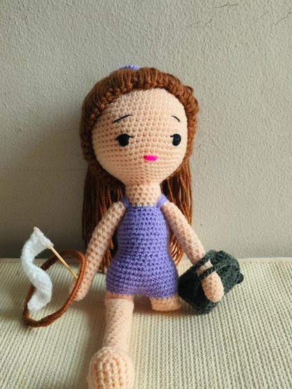 This is my 'Jimnastick' doll. She is a gymnast, and she comes with her ribbon and hoop accessories.