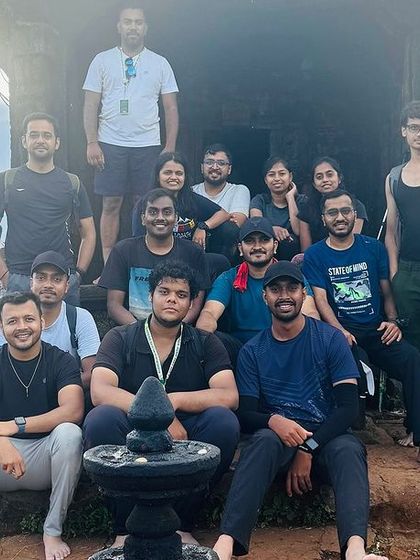 A group poses for a photo at a temple on a summit, a common and rewarding sight on our heritage treks.