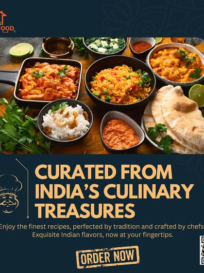 Our food is curated from India's culinary treasures. This top-down view of a classic Indian spread, including paneer, dal, and rice, showcases the exquisite flavors we offer.