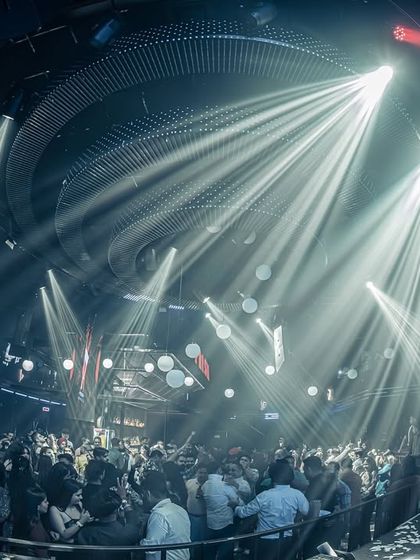 Beams of light shining down on the crowd at Prism Mohali.