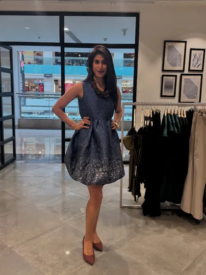 A great outfit is a complete look, from the silhouette to the shoes. Here, I'm wearing a structured dress that is perfect for an evening event. My goal is to help you build a wardrobe where you feel confident and stylish for any occasion.