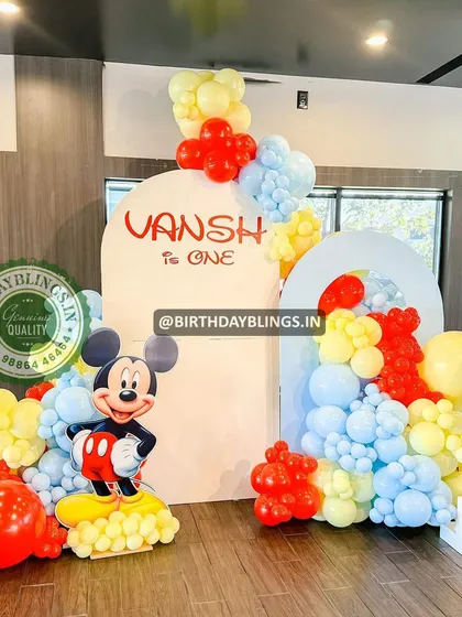 A full view of the Mickey Mouse first birthday decor, showing how it fills the space.