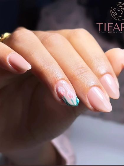 Monsoon into style with our tulip nail art. Gel polish on natural nails featuring delicate hand-painted tulips.