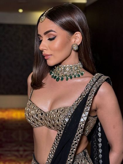 A profile view showing the soft makeup and sleek hair, a perfect combination.