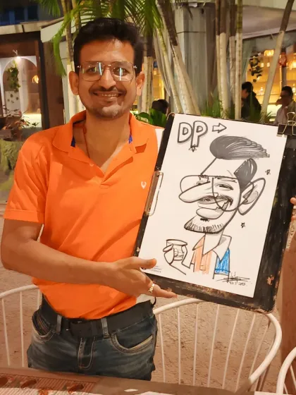 A guest at Nincasa Pune enjoying his caricature. I often add little details like the cup to personalize the drawing.