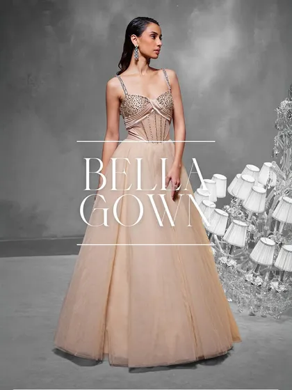 The Bella Gown is a study in structured beauty. I designed it with a detailed boned corset featuring phoenix-inspired motifs and a flowing tulle skirt, creating a breathtaking silhouette for any formal event.