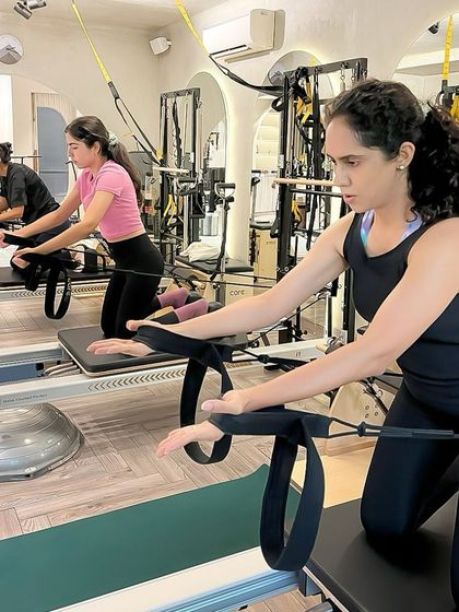 Focus on a single point, and let the body follow. This arm work on the Reformer requires concentration to keep the torso stable and the movement precise.