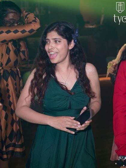 A candid shot of a guest singing along to the music.