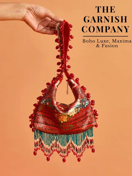 Embrace a boho-luxe vibe with this maximalist and fusion bag from The Garnish Company. The beadwork and fringe details make it a true statement piece for a mehendi or sangeet.