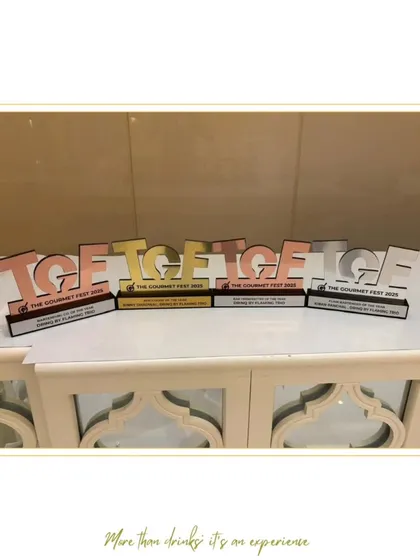Our collection of awards from The Gourmet Fest 2025 displayed together. These accolades for Bar Trendsetter, Mixologist, and Flair Bartender of the Year showcase the diverse talents within our team.