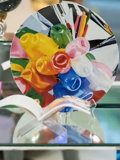 A closer look at the 'Tulips Coupe Plate' by Jeff Koons. The vibrant, balloon-like tulips are a signature of his style, now available exclusively at our gallery.