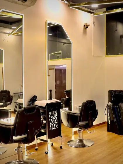 The styling area and hair wash stations, designed for a comfortable and luxurious client experience.