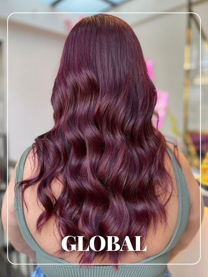 A full-head global colour in a stunning, vibrant shade of magenta. This look is for those who aren't afraid to make a statement with their hair.