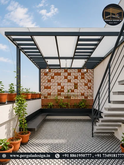 We transform compact terraces into stylish, functional retreats. This setup features a modern pergola with a translucent roof, a decorative jali brick privacy screen, and patterned floor tiles, creating a chic and private space for relaxation.