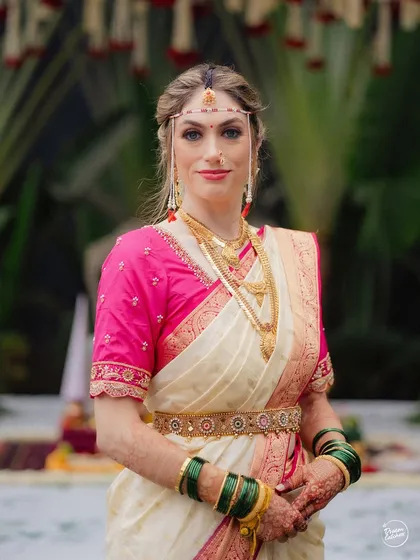 A beautiful portrait of a bride from another culture embracing Maharashtrian traditions for her wedding in Pune. She looks absolutely radiant in the traditional attire.