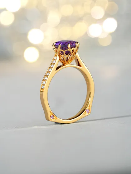 A closer look at the Amethyst Ring's craftsmanship. The gallery beneath the stone features intricate scrollwork, and a surprise pink sapphire is set on each side of the band. I believe true luxury is in these hidden details.