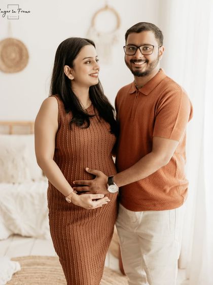 A classic, smiling portrait of an expecting couple in our boho studio. This shot is perfect for announcing the new arrival to family and friends.