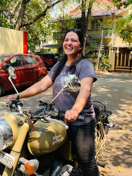 The pure, unadulterated joy of riding. This graduate's laughter captures the essence of the freedom found on two wheels.
