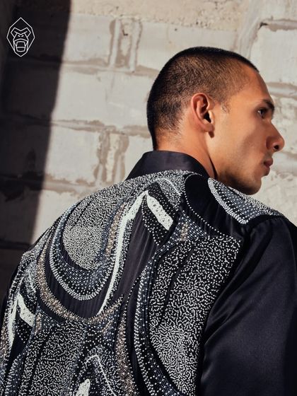 A detail shot of the Mythic Tapestry piece, highlighting the intricate patterns and textures that tell a story of folklore and ritual.