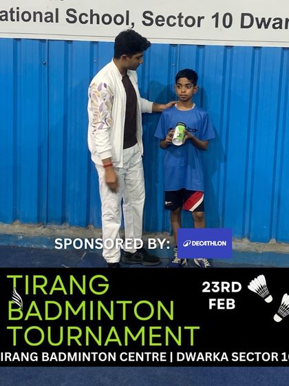 A moment of encouragement between an organizer and a young player.