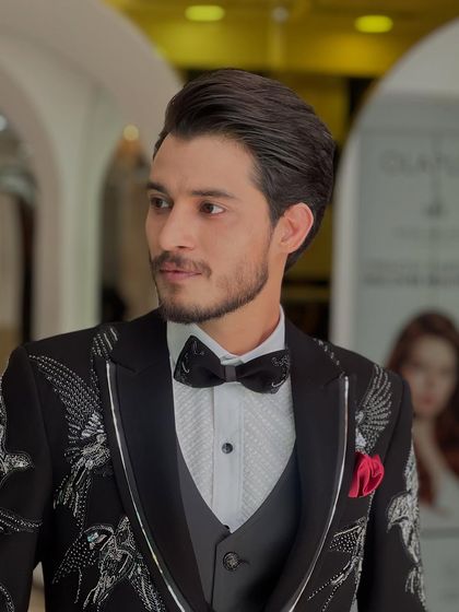 Another angle of this sophisticated men's style, showcasing the clean parting and classic shape.