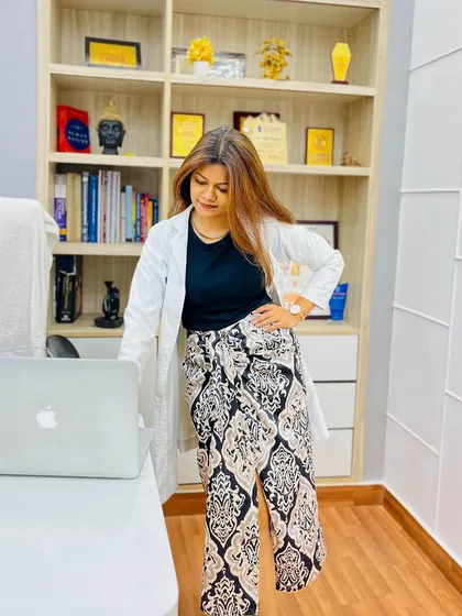 Standing in my office, where every book and award represents a step on my journey. It is a constant reminder of the dedication required in this field.