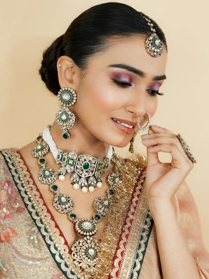 A beautiful demonstration of how to balance a dramatic eye with a well-defined lip, without one overpowering the other. This balance is key to professional bridal makeup.