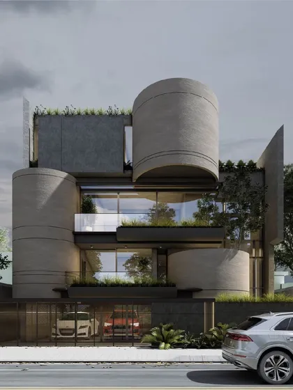 I designed this residence as a composition of bold, interlocking forms. The cylindrical concrete volumes create a powerful sculptural statement, softened by integrated planters and rooftop greenery that introduce a biophilic element to the modern facade.