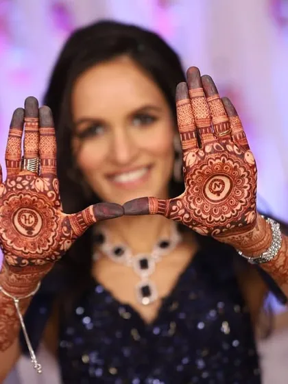 Mehendi adorns the hands and life takes on a new color. A beautiful shot of the bride showing her engagement mehendi.