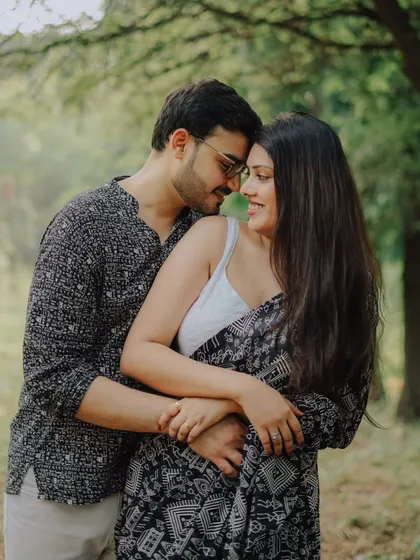 A warm embrace surrounded by nature. This intimate photo of Jayashree and Anand shows their deep connection during their traditional pre-wedding photoshoot.